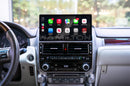 A dashboard of a 2014 - 2021 Lexus GX with the Hamilton Motor Company Conversion Kit installed and Apple CarPlay displayed on the screen. 