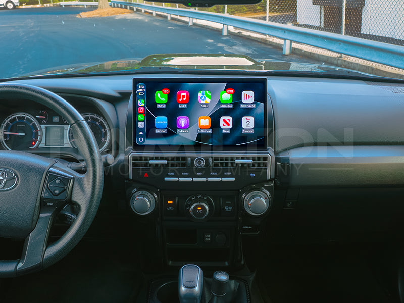 Dashboard of a Toyota 4Runner with the Hamilton Motor Company Premium Conversion Kit installed and CarPlay displayed on the screen.