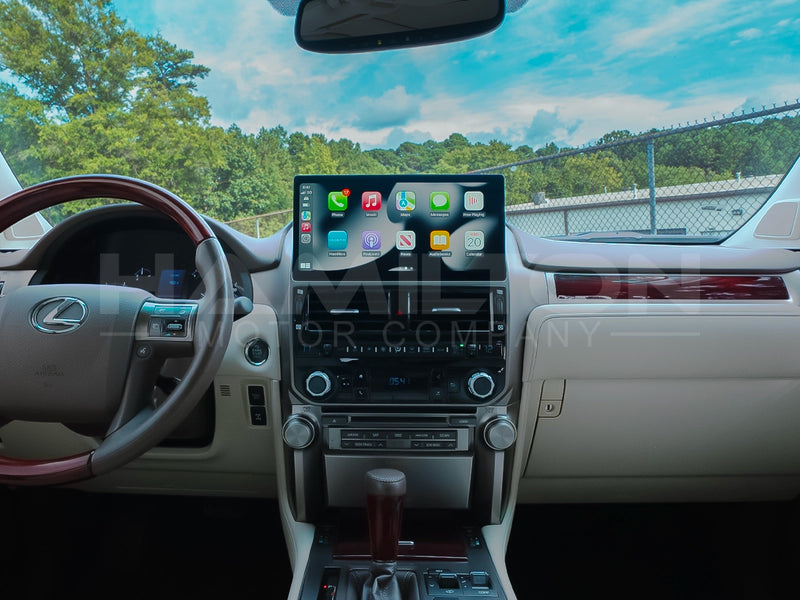 Dashboard of a 2010 - 2013 Lexus GX with the Hamilton Motor Company Conversion Kit installed with Apple CarPlay displayed on the screen. 