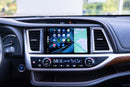 A dashboard of a 2014-2019 Toyota Highlander with the Hamilton Motor Company Conversion Kit installed and Android Auto displayed on the screen. 