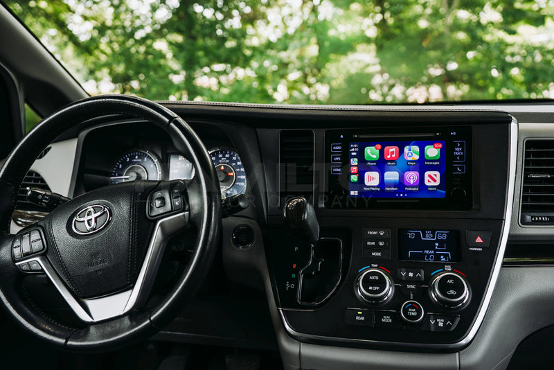 A dashboard of a Toyota Sienna with the Hamilton Motor Company Conversion Kit installed and Apple CarPlay displayed on the screen. 