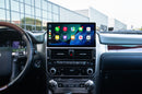 A dashboard of a 2014 - 2021 Lexus GX with the Hamilton Motor Company Conversion Kit installed and Apple CarPlay displayed on the screen. 